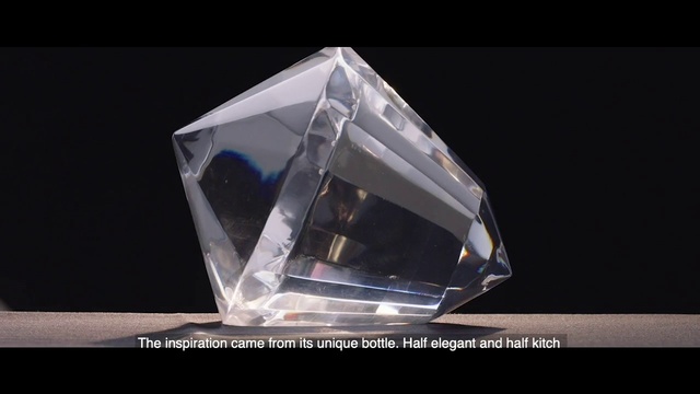 Video Reference: Triangle, Rectangle, Automotive design, Art, Automotive lighting, Jewellery, Font, Electric blue, Crystal, Glass