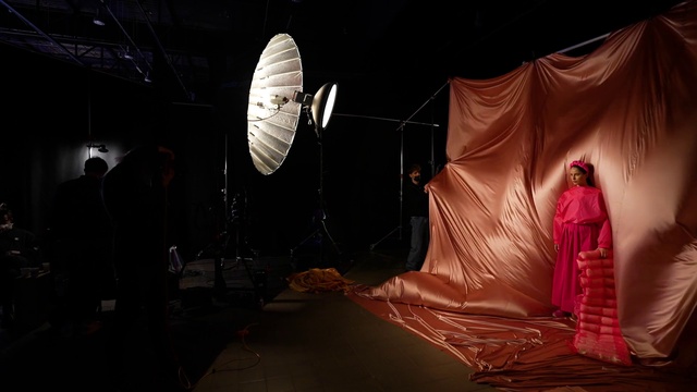 Video Reference: Entertainment, Tent, Tints and shades, Performing arts, Event, Art, Fashion design, Darkness, Peach, Visual arts