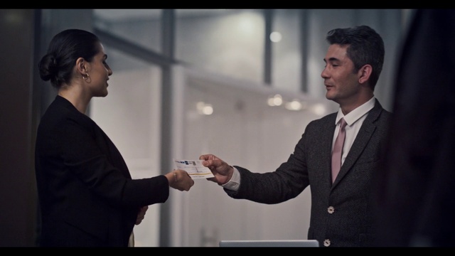 Video Reference: Coat, Flash photography, Tie, Gesture, Sleeve, Suit, Greeting, Blazer, White-collar worker, Formal wear