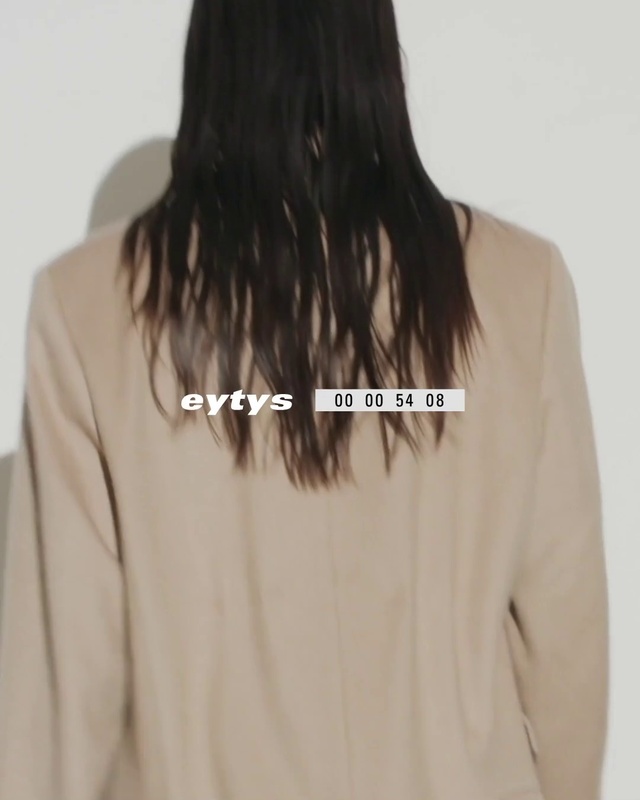 Video Reference: Outerwear, Neck, Sleeve, Waist, Street fashion, Grey, Collar, Dress shirt, Fashion design, Font