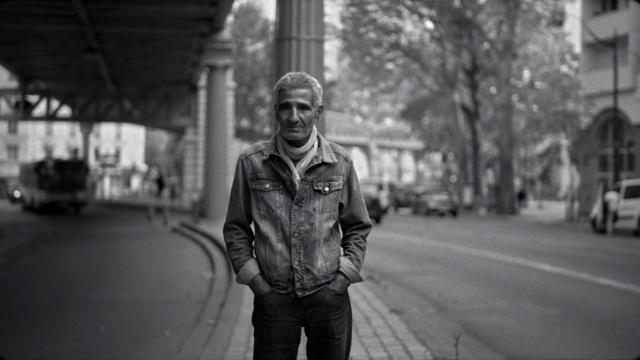 Video Reference: Flash photography, Standing, Architecture, Black-and-white, Beard, Grey, Style, Leather jacket, Road surface, Eyewear