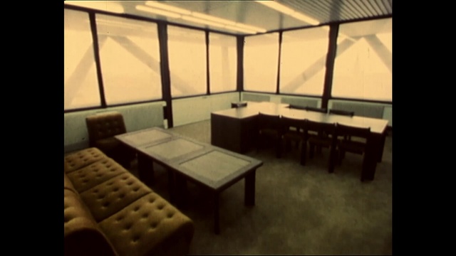 Video Reference: Furniture, Table, Building, Wood, Interior design, Shade, Floor, Chair, Flooring, Rectangle