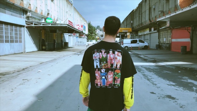 Video Reference: Tire, Plant, Road surface, Asphalt, Street fashion, Sleeve, Travel, Sidewalk, Cool, Road