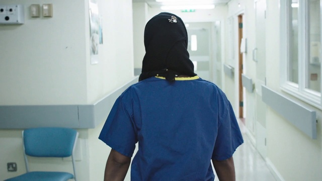 Video Reference: Shoulder, Blue, Sleeve, T-shirt, Gas, Elbow, Personal protective equipment, Electric blue, Window, Room