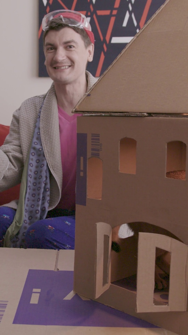 Video Reference: Smile, Wood, House, Cap, Event, Cardboard, Room, Baseball cap, Eyewear, Job