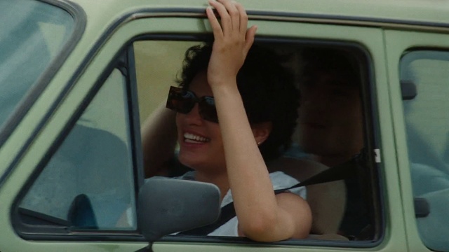 Video Reference: Glasses, Smile, Vehicle, Motor vehicle, Sunglasses, Automotive mirror, Hood, Automotive exterior, Car, Mammal