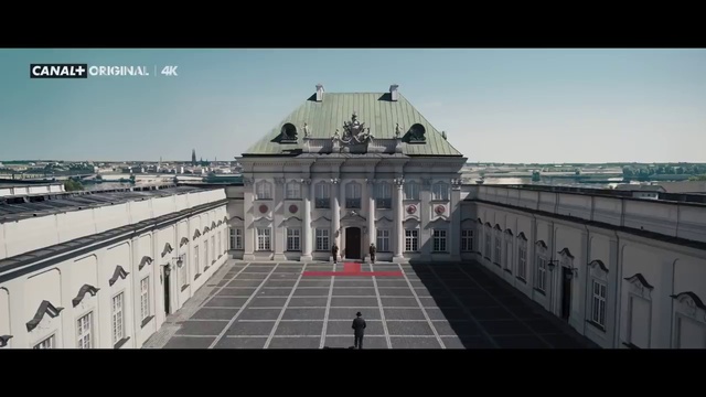 Video Reference: Sky, Building, Urban design, City, Facade, Symmetry, Roof, Rectangle, Window, Monument