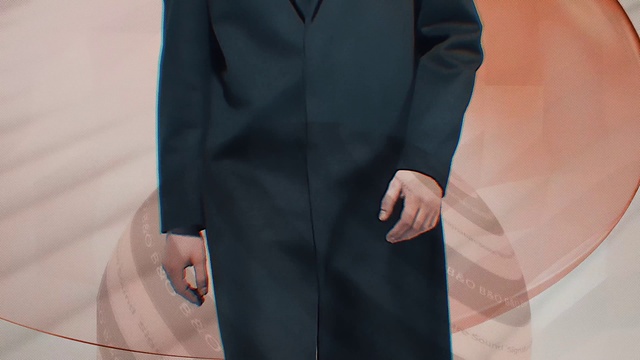 Video Reference: Dress shirt, Neck, Sleeve, Street fashion, Gesture, Grey, Collar, Waist, Formal wear, Blazer