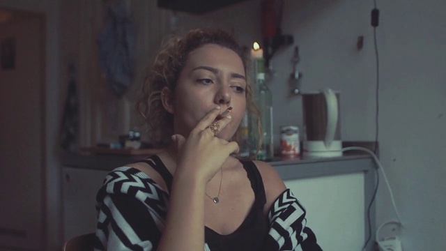 Video Reference: Eyelash, Neck, Flash photography, Jaw, Gesture, Eyewear, Tableware, Fashion design, Long hair, Chest