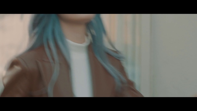 Video Reference: Shoulder, Mouth, Eyelash, Jaw, Ear, Neck, Sleeve, Gesture, Electric blue, Chest