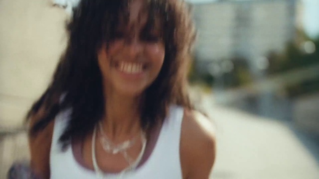Video Reference: Hair, Smile, Lip, Eyebrow, Active tank, Jaw, Undershirt, Eyelash, Street fashion, Happy