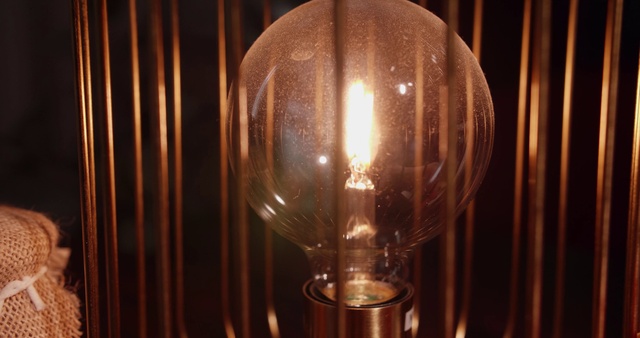 Video Reference: Light, Wood, Automotive lighting, Amber, Lamp, Light bulb, Tints and shades, Barware, Glass, Symmetry