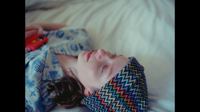 Video Reference: Neck, Textile, Comfort, Tartan, Happy, Eyelash, Plaid, Pattern, Electric blue, Linens