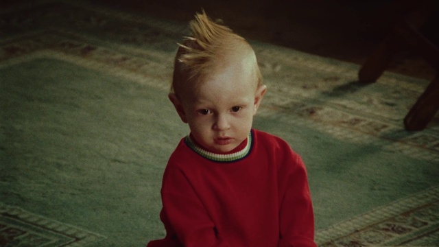 Video Reference: Face, Head, Eye, Flash photography, Wood, Asphalt, Floor, Flooring, Tree, Toddler