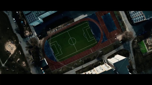 Video Reference: Urban design, Building, Landscape, Grass, Soccer, Team sport, City, Ball game, Engineering, Mixed-use