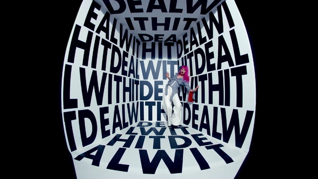 Video Reference: Sleeve, Font, T-shirt, Circle, Symmetry, Pattern, Electric blue, Logo, Graphics, Brand