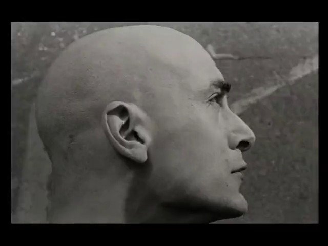 Video Reference: black and white, profile, side view, bald, head, close-up, portrait, human, face, monochrome, studio, texture