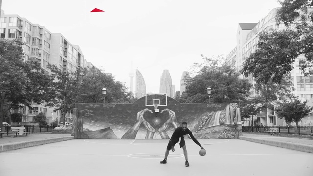 Video Reference: Building, Sky, Infrastructure, Tree, Sports equipment, Kickflip, Black-and-white, Style, Rolling, Street stunts