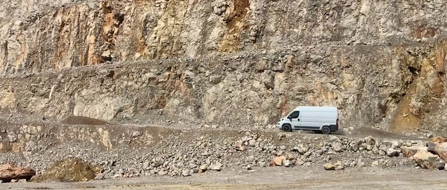 Video Reference: Car, Vehicle, Motor vehicle, Bedrock, Slope, Geological phenomenon, Landscape, Wood, Road, Soil