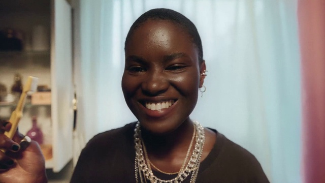 Video Reference: Forehead, Smile, Skin, Chin, Eyebrow, Hairstyle, Facial expression, Human, Happy, Adaptation