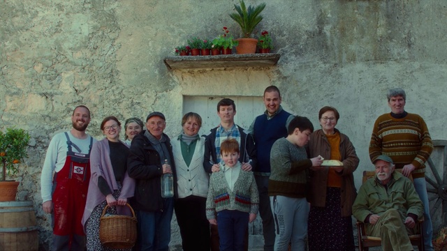 Video Reference: Trousers, Smile, Plant, Temple, Flowerpot, Houseplant, Leisure, Jacket, Event, Luggage and bags