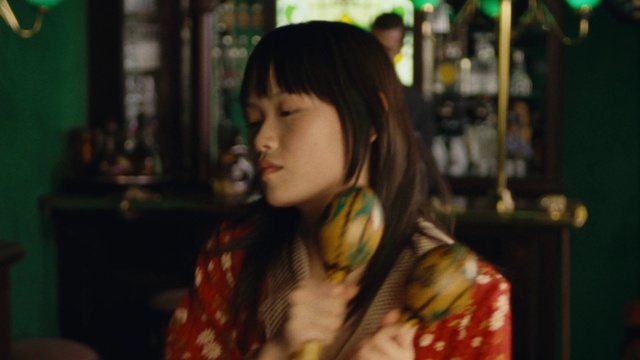 Video Reference: Green, Fun, Happy, Bangs, Street fashion, Tartan, Long hair, Brown hair, City, Plaid