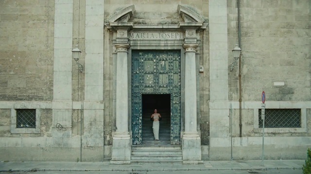 Video Reference: Door, Facade, Tints and shades, Symmetry, Window, City, Building, Arch, Composite material, Column