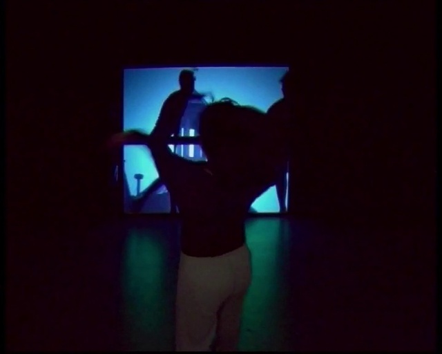 Video Reference: Gesture, Performing arts, Entertainment, Art, Display device, Electric blue, Magenta, Event, Projection screen, Visual effect lighting