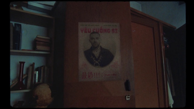 Video Reference: Brown, Font, Shelf, Tie, Bookcase, Signage, Event, Room, Publication, Picture frame