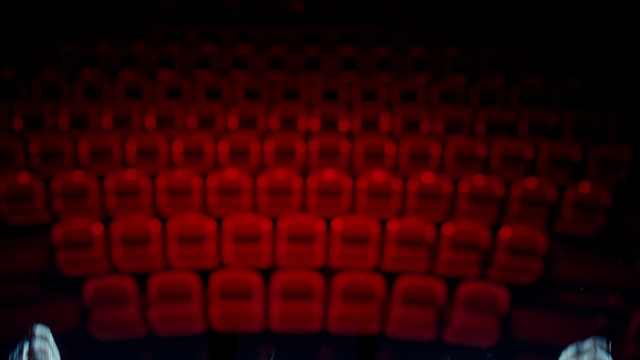 Video Reference: Movie theater, Rectangle, Gas, Pattern, Entertainment, Event, Electric blue, Magenta, Chair, Carmine