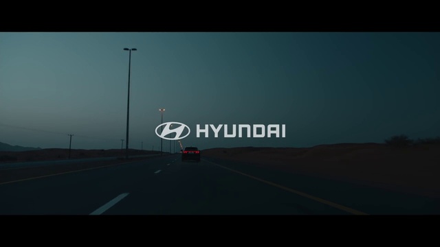 Video Reference: Sky, Asphalt, Road surface, Mode of transport, Automotive tire, Thoroughfare, Natural landscape, Car, Font, Road