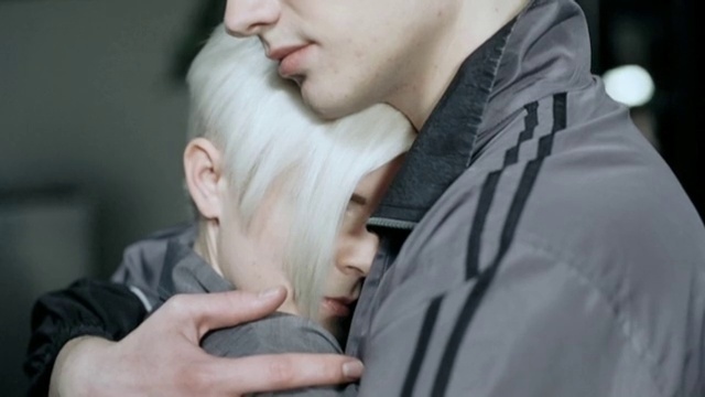 Video Reference: Outerwear, Sleeve, Gesture, Beard, Street fashion, Eyelash, Happy, Facial hair, Eyewear, Formal wear