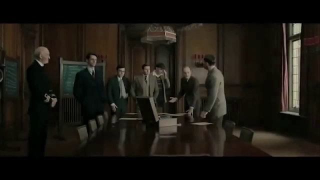 Video Reference: Flash photography, Gesture, Table, Suit, Formal wear, White-collar worker, Event, Fun, Entertainment, Desk