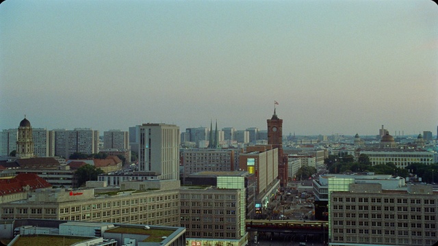 Video Reference: Sky, Building, Daytime, Skyscraper, Tower, Window, Urban design, Tower block, Condominium, Neighbourhood