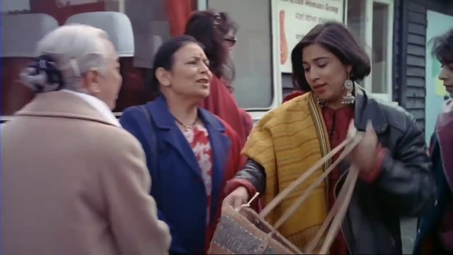 Video Reference: Temple, Hat, Interaction, Event, Travel, Crowd, Conversation, Street fashion, Scarf, Suit