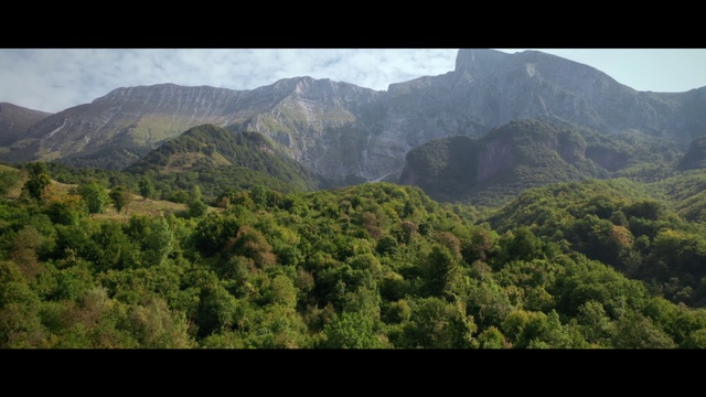Video Reference: Sky, Mountain, Cloud, Natural landscape, Terrain, Terrestrial plant, Landscape, Grassland, Tree, Cumulus