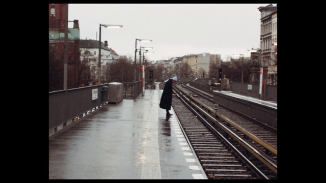 Video Reference: Sky, Building, Window, Mode of transport, Atmospheric phenomenon, Road surface, Black-and-white, Tree, Morning, Road
