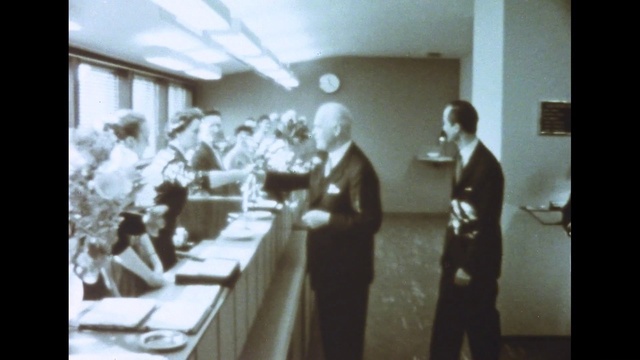 Video Reference: Coat, Style, Suit, Table, Event, Monochrome photography, Vintage clothing, Monochrome, Room, Chair