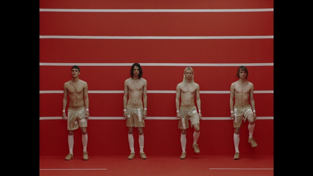 Video Reference: Chin, Shorts, Shoulder, Leg, Human body, Thigh, Performing arts, Underpants, Barechested, Red