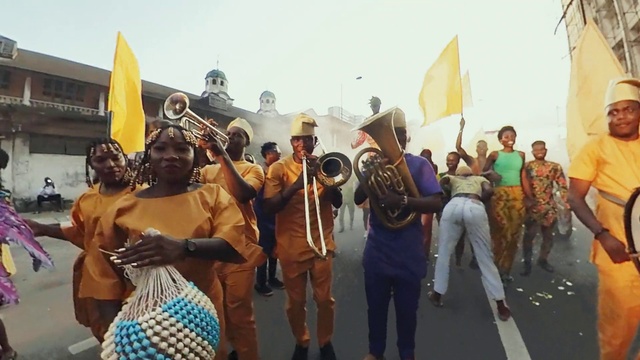 Video Reference: Sky, Flag, Gesture, Dress, Headgear, Shorts, Crowd, Drum, Event, Tradition