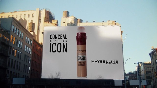 Video Reference: billboard, advertisement, makeup, concealer, Maybelline, city street, urban, outdoor, cosmetics, branding, building, sky, poster, street scene