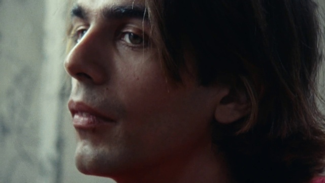 Video Reference: Nose, Cheek, Lip, Eyelash, Ear, Flash photography, Jaw, Gesture, Black hair, Darkness