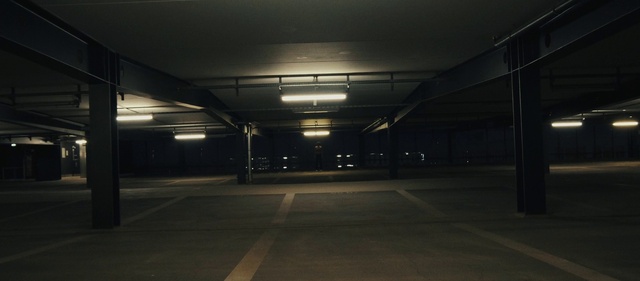 Video Reference: Electricity, Road surface, Asphalt, Parking, Tints and shades, Symmetry, Road, City, Darkness, Ceiling