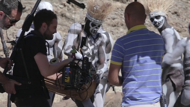 Video Reference: Hairstyle, Human, Social group, Art, Public space, Eyewear, Fun, T-shirt, Adaptation, Crowd