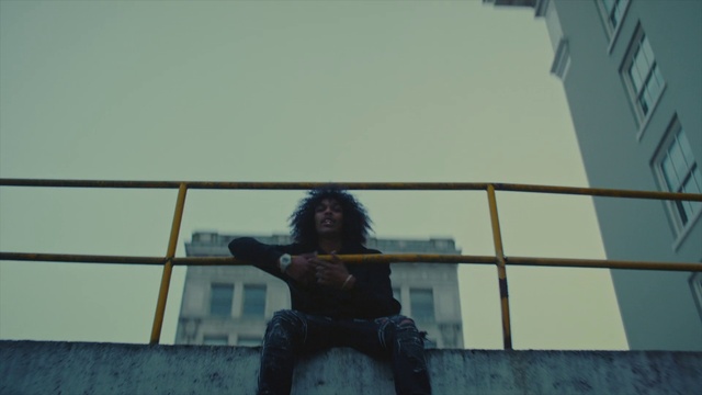 Video Reference: Sky, Tints and shades, Waist, Happy, Roof, Metal, Sitting, City, Fun, Shadow