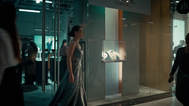 Video Reference: One-piece garment, Waist, Flooring, Fashion design, Display case, Glass, Formal wear, Event, Day dress, Transparent material