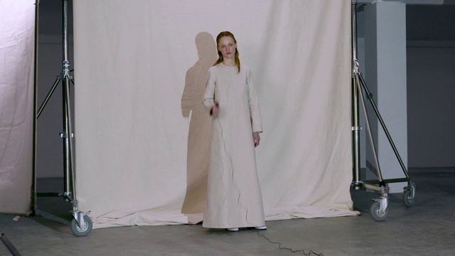Video Reference: Fashion design, Flooring, Formal wear, Event, Bridal accessory, Bridal clothing, Peach, Chair, Gown, Costume