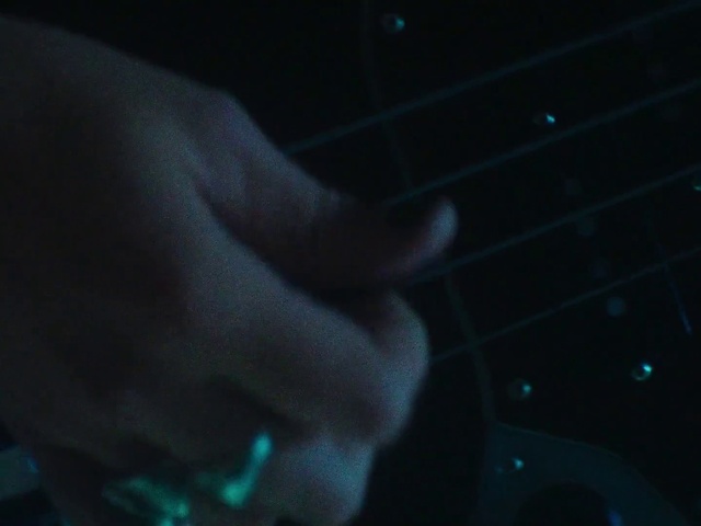 Video Reference: Guitar accessory, Gesture, Entertainment, Musical instrument, Electric blue, Space, Musical instrument accessory, Wrist, Human leg, Event