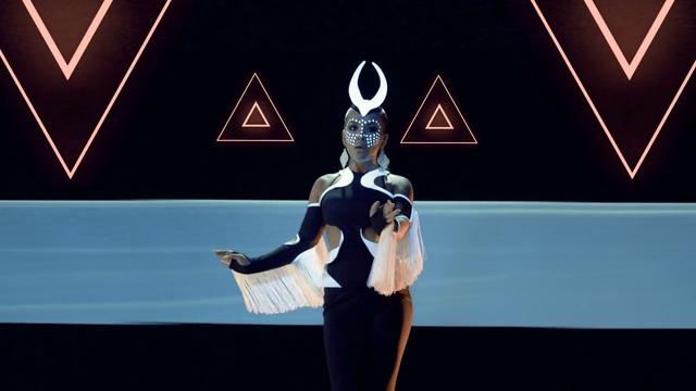 Video Reference: Gesture, Electric blue, Entertainment, Performing arts, Fashion design, Event, Costume design, Fictional character, Choreography, Logo