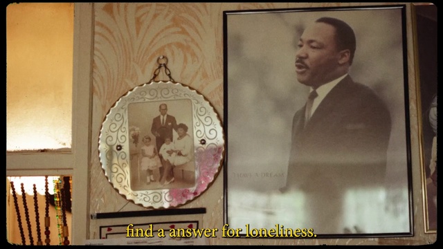 Video Reference: Art, Event, Formal wear, Picture frame, Visual arts, Font, Suit, Room, Rectangle, History